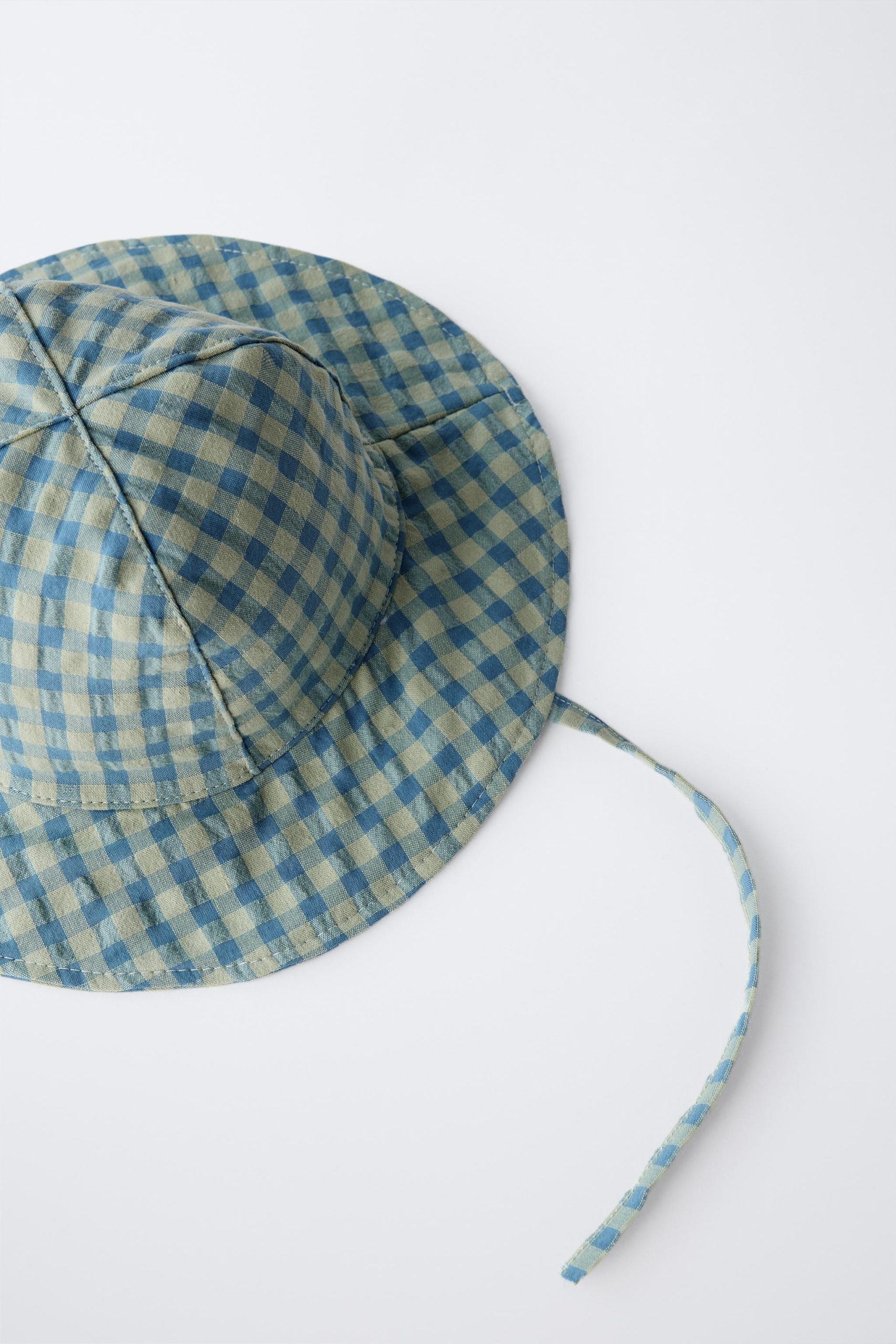 کلاه چهارخانه با بند تنظیمی از برند زارا (بچه گانه)