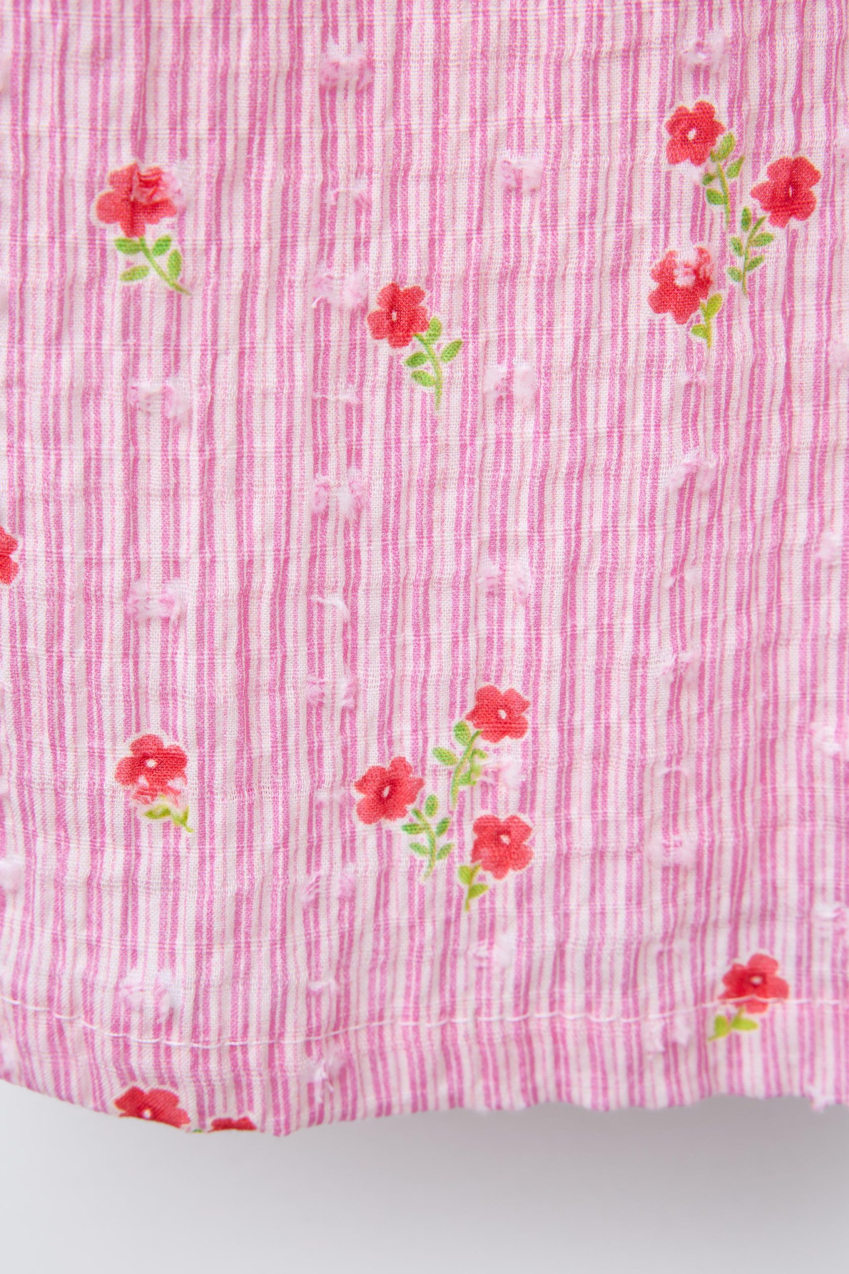 تولم کوتاه یقه صاف با توری گلدار از برند زارا (بچه گانه)