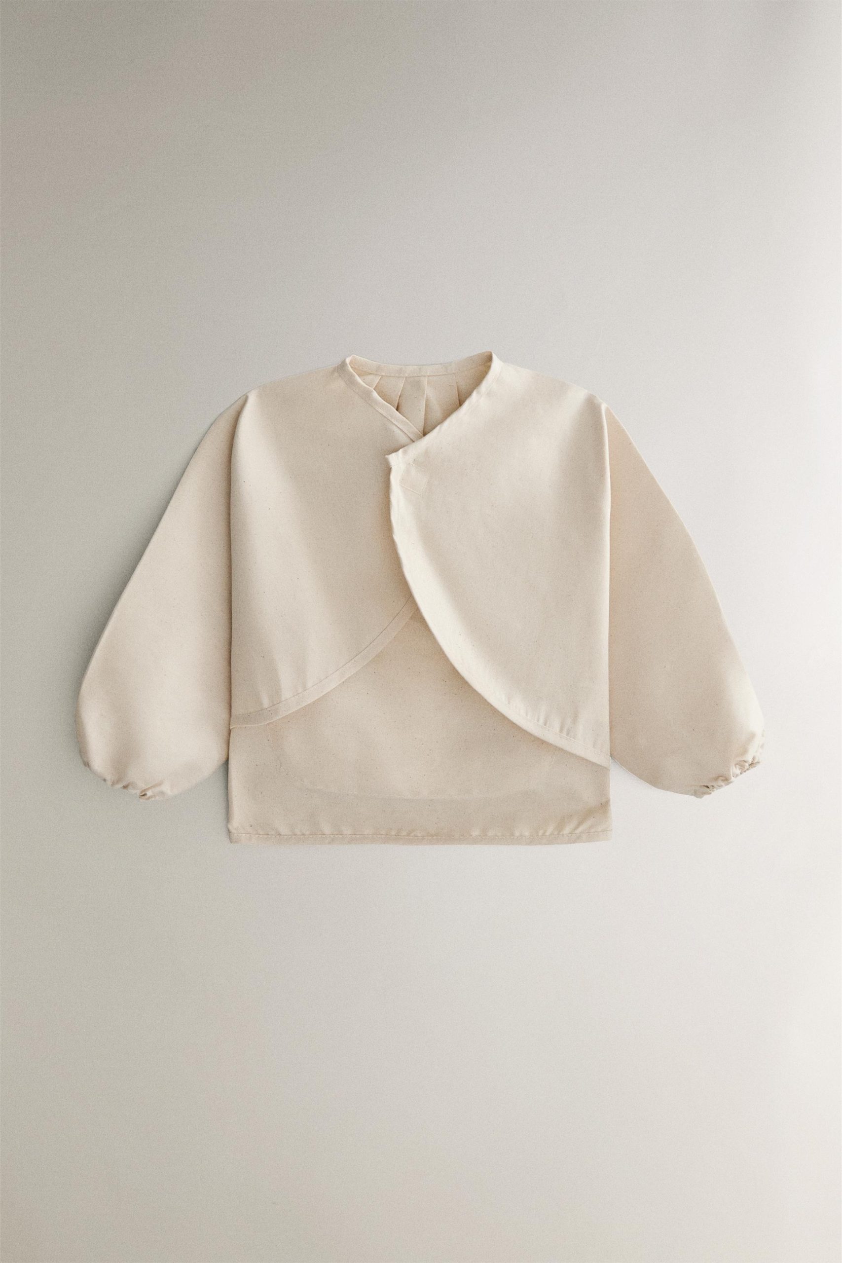 پیشبند نوزاد با طرح سگ مسابقهای از برند زارا