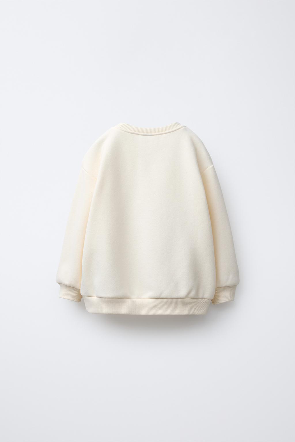 سویشرت آستین بلند یقه گرد با تزئینات از برند زارا (بچه گانه)