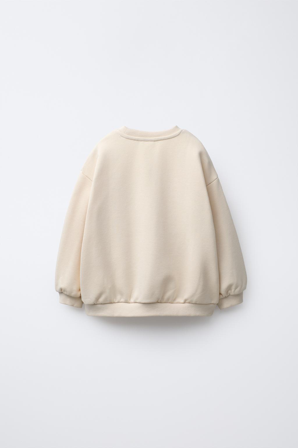 سویشرت آستین بلند یقه گرد با جیب قلبی از برند زارا (بچه گانه)